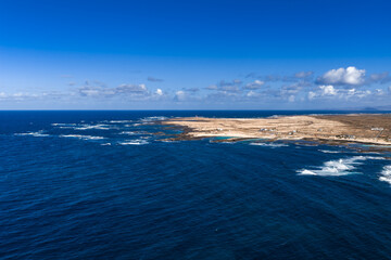 Aerial view of Fuerteventura north shore, Playa del Bajo de la Burra, pale sand, cobalt Atlantic,...