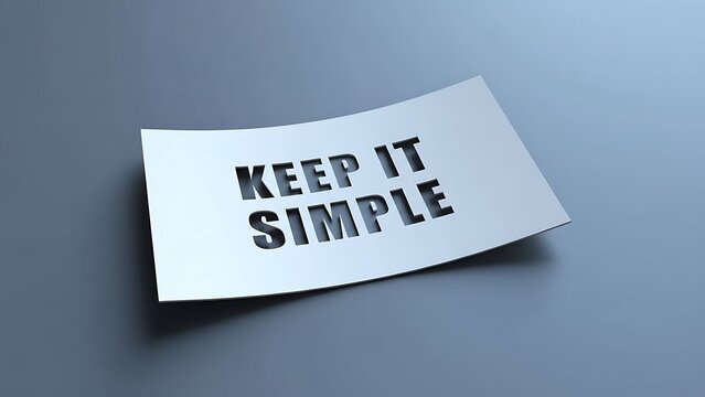 White paper with cut-out text 'KEEP IT SIMPLE' casting shadow on a muted blue-gray gradient background, minimalist design.