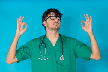 young doctor isolated in background with a relaxed expression