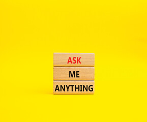 Question symbol. Concept words Ask me Anything on wooden blocks. Beautiful yellow background. Business and Ask me Anything concept. Copy space