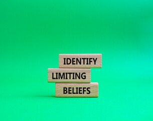Limiting Beliefs symbol. Concept word Identify Limiting Beliefs on wooden blocks. Beautiful green background. Business and Limiting Beliefs concept. Copy space