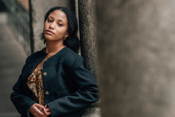 portrait of a young hispanic latin american woman on the street