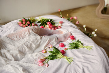 Relaxed floral scene, Individual casually reclining amidst floral arrangement and scattered petals