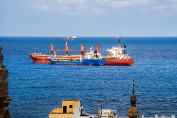 Cargo ships off the coast of Las Palmas, Gran Canaria &ndash; photographed from the city area towards the Atlantic Ocean