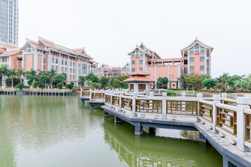 Obraz premium Jimei University Campus Waterfront with Colonial Architecture and Bridge