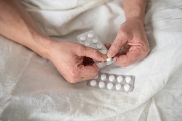 Fotobehang Natuur Park Blister pack of pills in senior man hands  © mizina