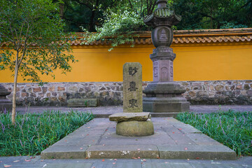 Fototapeta premium Buddhist Temple Garden, Ningbo - Stone Monuments and Yellow Wall