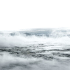 Obraz premium Ethereal mist rolls across a stark, textured landscape with a distant mountain range