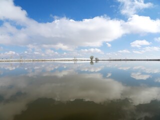 Calm Lake with Cloud Reflections After Spring Snowfall, Colorado