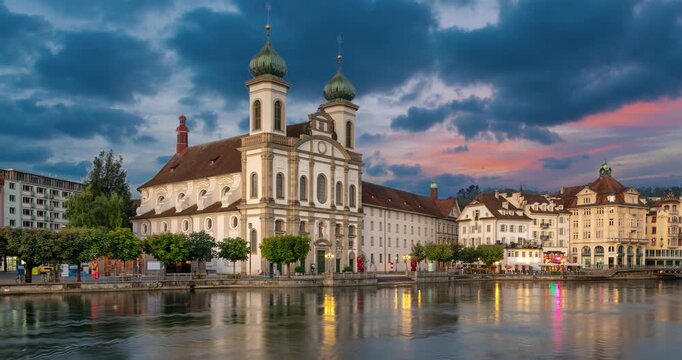 Lucerne, Switzerland - view of baroque Jesuit Church and river Reuss  (static image with animated sky and water)