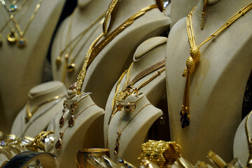 gold shop windows at istanbul grand bazar or Kapali Carsi, Turkey. Jewelry in the store window. A lot of luxury jewelry in the oriental market. Concept of shopping in Middle East.
