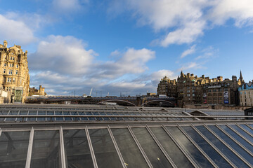 Cityscape with Ornate Buildings, Bridge, and Train Station Roof  in Edinburgh, Scotland.