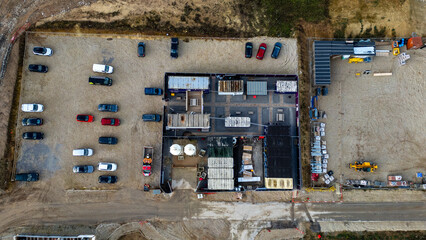 Construction site with modular buildings and vehicles at Taylor Wimpey, Ripon.