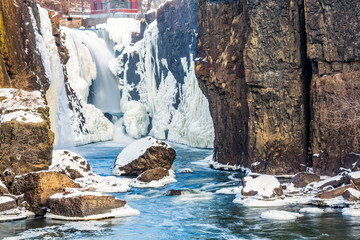 Paterson, NJ Great Falls National Historical Park with frozen Passaic River waters in the winter
