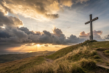 A silhouette of a wooden religious cross stands as a spiritual symbol of faith and Easter against a sunset mountain landscape under a blue sky with clouds