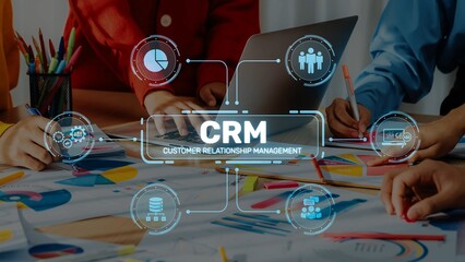 A collaborative workspace showcasing teams using technology for customer relationship management, emphasizing data visualization and strategic planning in business. Raster