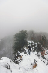 Person Hiking in Snowy Winter Landscape