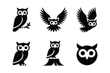 Fototapeta premium Set of Black Owl Silhouettes in Different Standing and Flying Poses