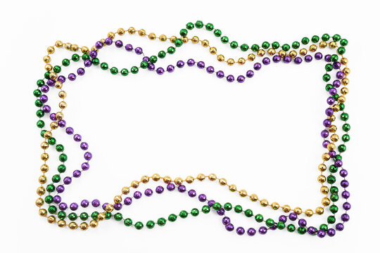 Mardi gras beads creating colorful border frame