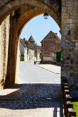Obraz premium Stone medieval gateway opens to a charming town Provins, France