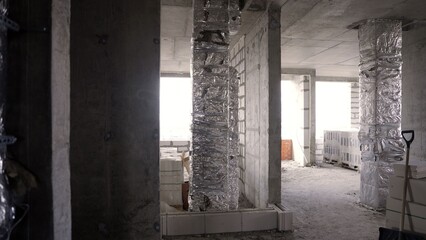 Building interior with foil insulation during construction