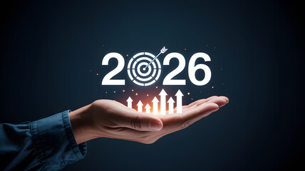 Person holding 2026 with target and upward arrows signifying business goals and achievements