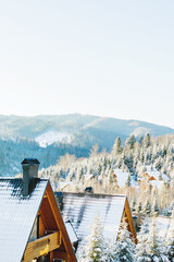 Snowy Mountain Chalets in a Winter Forest Village