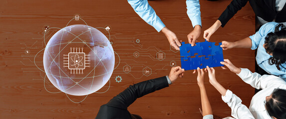 Business team collaboratively solves a puzzle representing technology and innovation, showcasing teamwork and creativity in a modern corporate setting. Trope