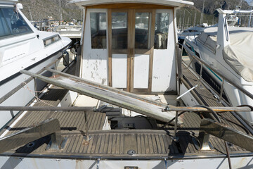 Boat interior with wooden elements and surrounding vessels.. Palma de Mallorca, Spain