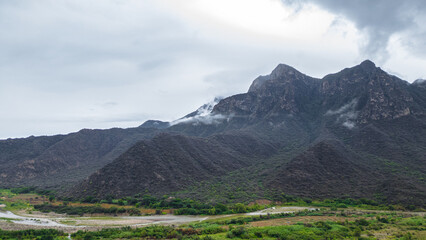 Panoramic aerial drone view of the mountains of Mayasc&oacute;n covered by clouds, Lambayeque, Peru
