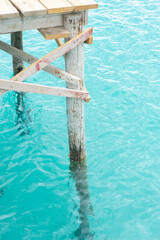 Fototapeta premium Wooden pier above clear turquoise water.. Palma de Mallorca, Spain