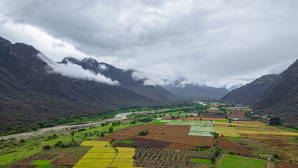 Aerial drone view of the valley and village of Mayasc&oacute;n surrounded by mountains in Lambayeque, Peru