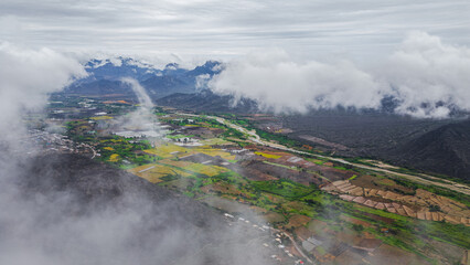 Aerial drone view of the valley and village of Mayasc&oacute;n surrounded by mountains in Lambayeque, Peru