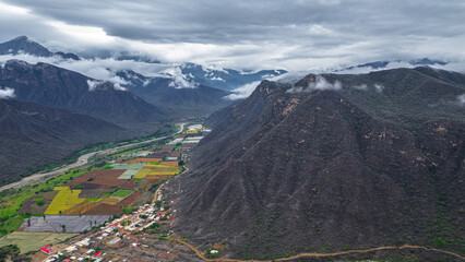 Aerial drone view of the valley and village of Mayasc&oacute;n surrounded by mountains in Lambayeque, Peru