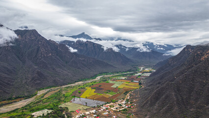 Aerial drone view of the valley and village of Mayasc&oacute;n surrounded by mountains in Lambayeque, Peru