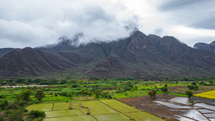 Aerial drone view of the valley and village of Mayasc&oacute;n surrounded by mountains in Lambayeque, Peru
