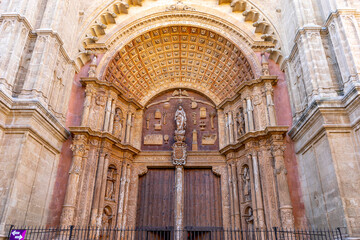 Fototapeta premium Intricate architectural details of a grand entrance.. Cathedral of Palma de Mallorca, Spain