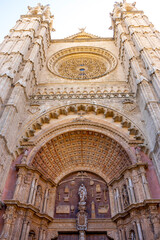 Obraz premium Intricate facade of a historic cathedral in Palma.. Cathedral of Palma de Mallorca, Spain