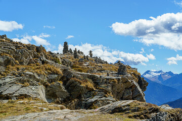 Alpine mountains in autumn, San Bernardino Pass in Switzerland The sky is blue, light, cloudy