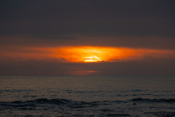 Fototapeta premium Golden sunset over a tropical landscape in Costa Rica