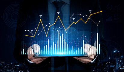 A businessman in a suit holds a tablet showing financial data and growth charts, with a vibrant night cityscape in the background, representing business analysis. Scalp