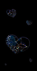 Broken crystal glass heart with colorful dispersion and rainbow reflections on black background. Fragile 3D heart pieces floating in dark space. Conceptual romantic 3D illustration.