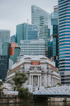 Architectural Evolution: The Fullerton Hotel and Anderson Bridge Against the Singapore Skyline