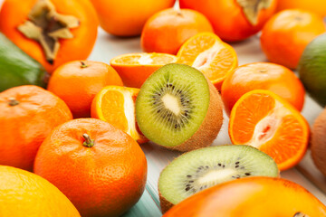 sliced kiwi tangerine on wood background