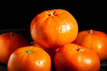 tangerine heap on black background