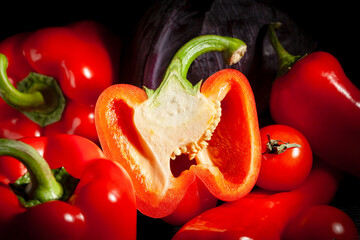 sliced bell pepper vegetable mix on black background