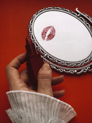 Kiss on the mirror and lipstick. Valentine`s Day still life aesthetic