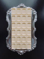 Chocolate bar on a silver tray