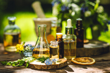 Natural ingredients in cosmetic and medicine. Assortment of organic essential oils in glass...