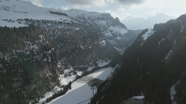 Drone Pullback Revealing Hairpin Mountain Road in Alpine Valley - Flaine, France - 4K